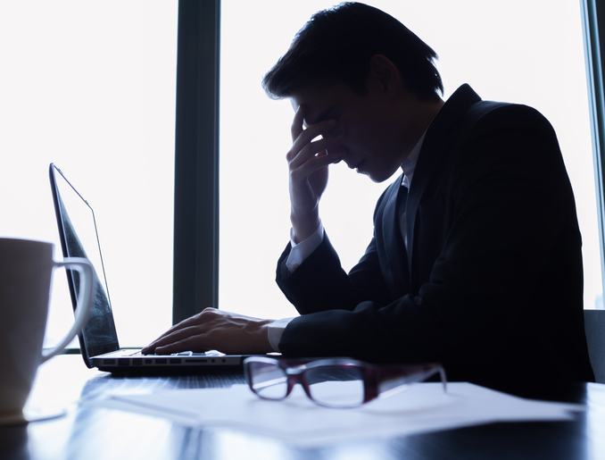 Image of a man frustrated with emails. Read our email management tips.