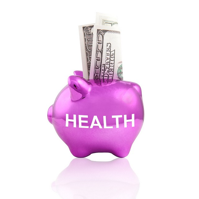 TPAs and self-insurd plans can save your small business money. Image is a piggy bank with a $100 bill. “Health Care Cost” by Tax Credits licensed by CC BY 2.0 