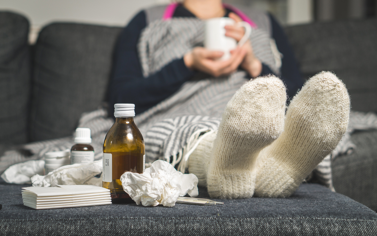 Image of an employee who used telemedicine to contact a doctor about the flu.