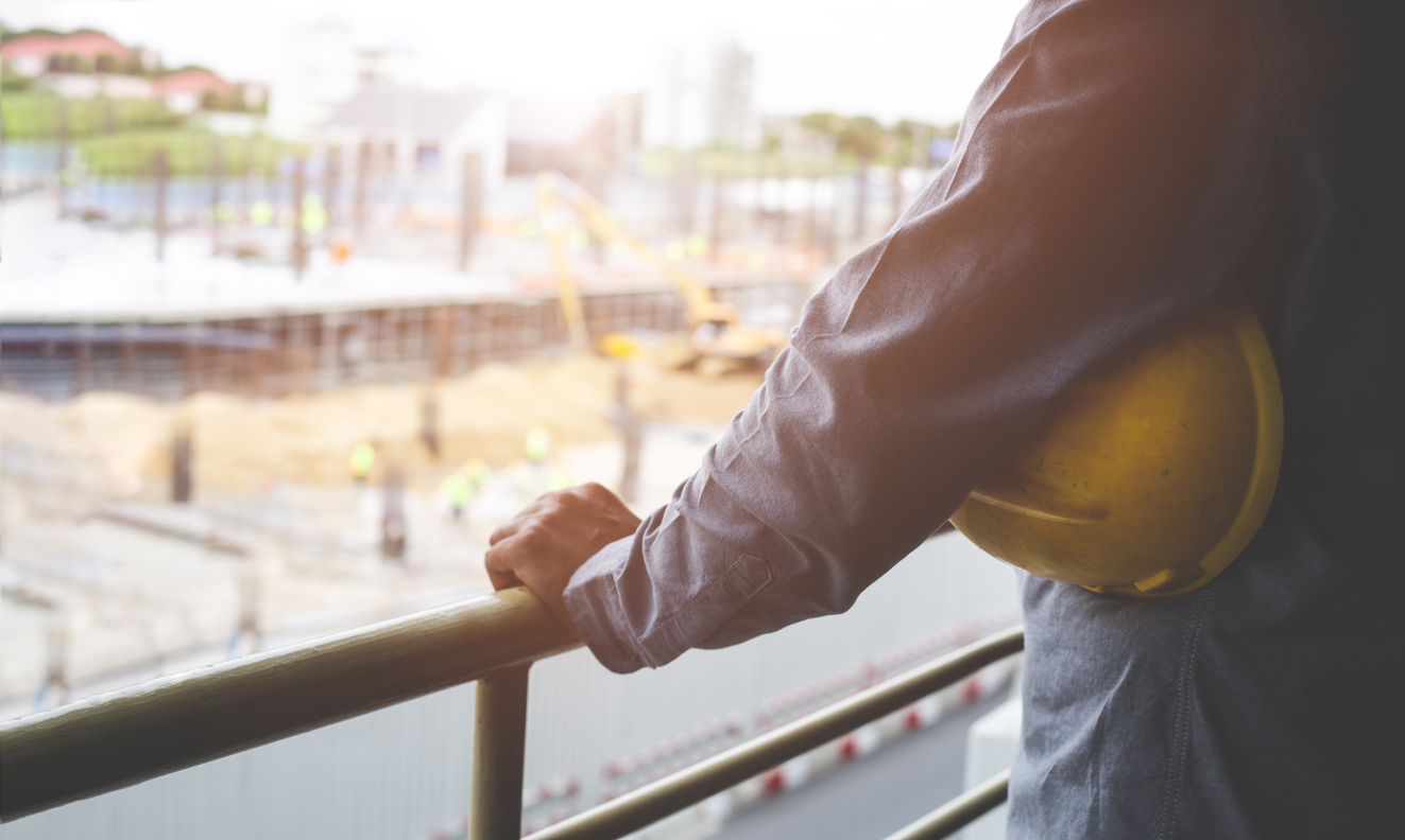 An OSHA inspector reviewing the worksite of a small business.