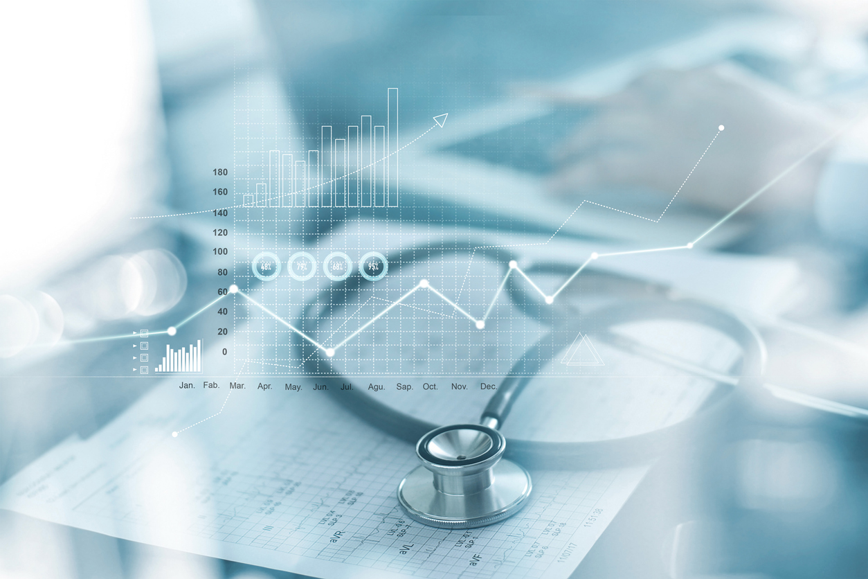 An overlay of helathcare system charts from overwhelming chronic illness over basic medical equipment.