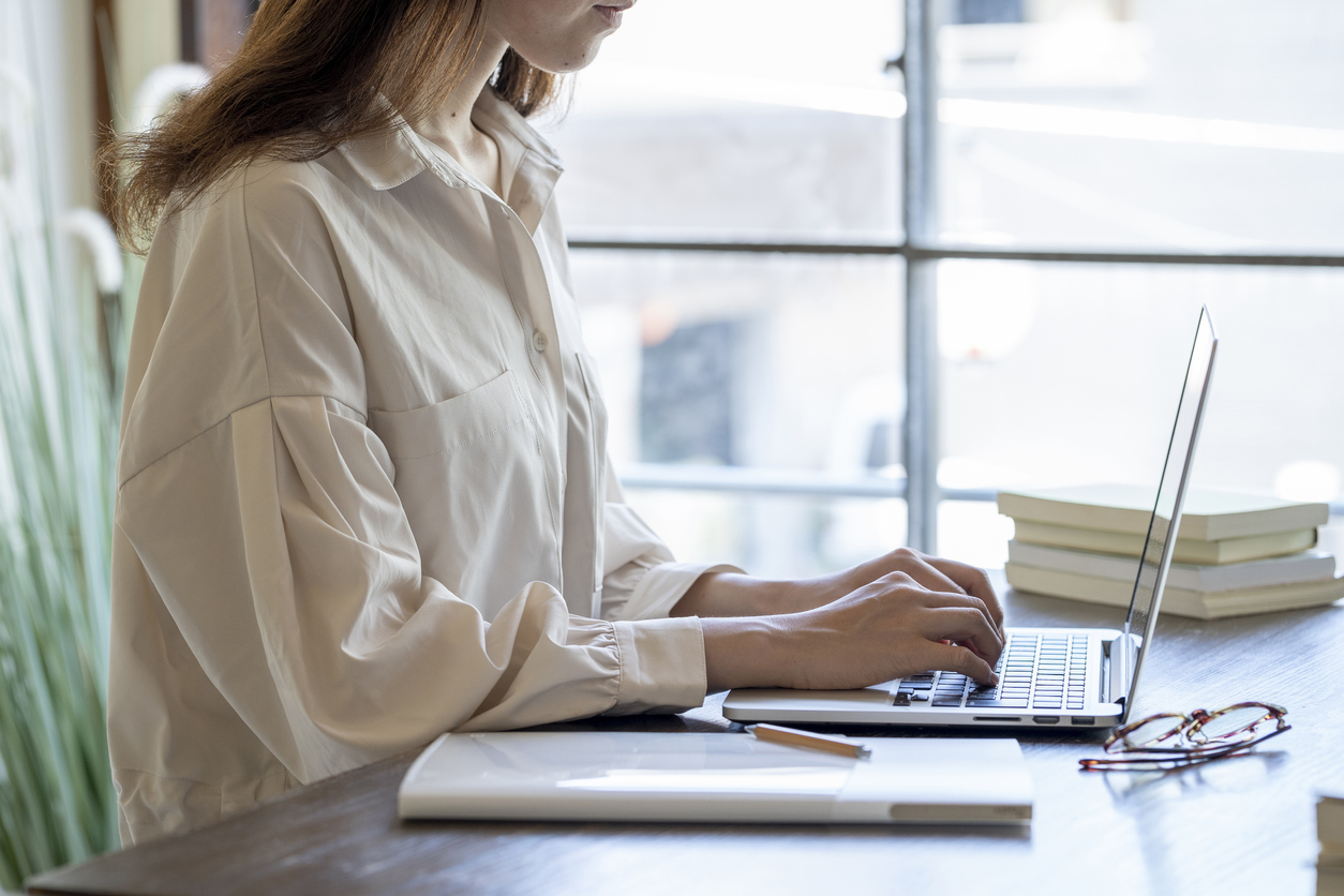 An employee working from home in a safe designated work area.