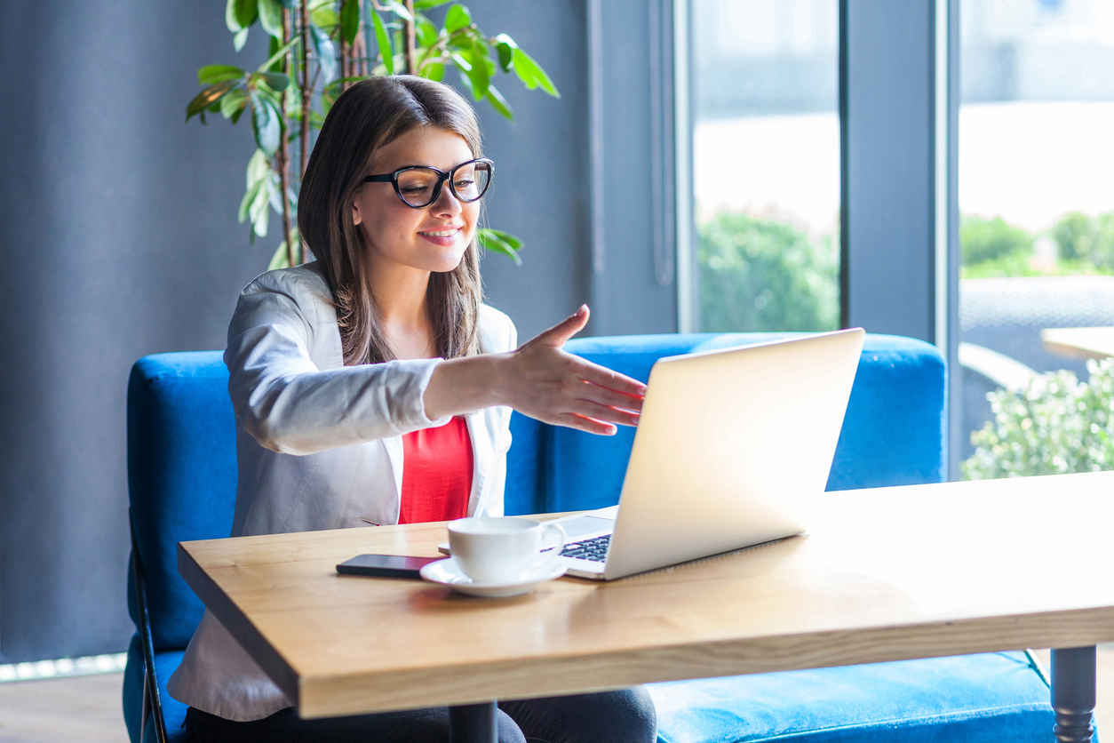 A job candidate going through a video interview with a small business owner.