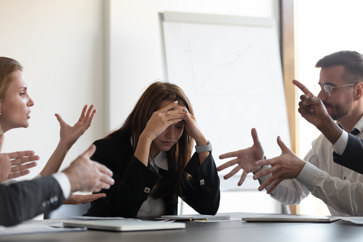 A group of employees arguing after discussing politics in the workplace.