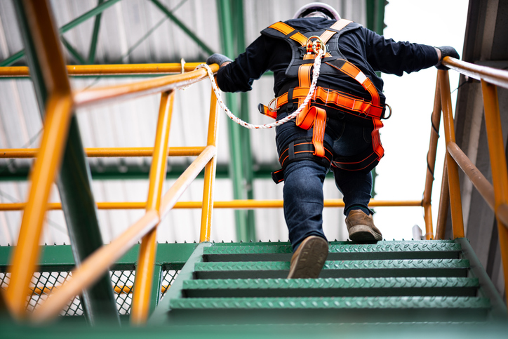 An employee using safety training to reduce workers’ comp costs and claims for small businesses.